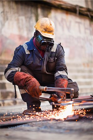 spark - Welder at work on dry dock Stock Photo - Premium Royalty-Free, Code: 6122-08229878