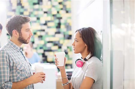 designers collaboration - Creative business people with coffee and headphones talking in office Stock Photo - Premium Royalty-Free, Code: 6124-08170743