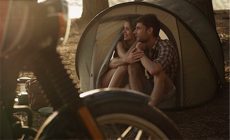 simsearch:841-02720357,k - Affectionate young couple in tent Stock Photo - Premium Royalty-Free, Code: 6124-08658139