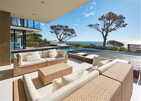 simsearch:6124-08703974,k - Modern luxury home showcase patio with sunny ocean view Stock Photo - Premium Royalty-Free, Code: 6124-08704013