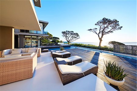 simsearch:6124-08703974,k - Modern luxury home showcase patio with ocean view Stock Photo - Premium Royalty-Free, Code: 6124-08704018