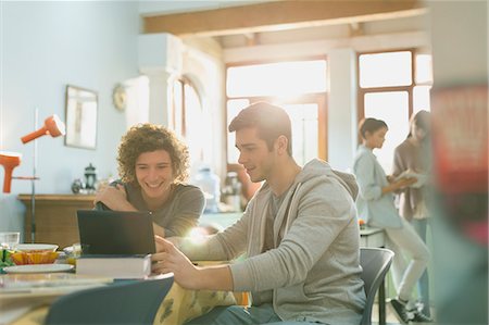 simsearch:6113-06908601,k - Young men college students studying with laptop at table Stock Photo - Premium Royalty-Free, Code: 6124-08821059