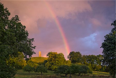 Tranquil rainbow over rural countryside park Stock Photo - Premium Royalty-Free, Code: 6124-08945975