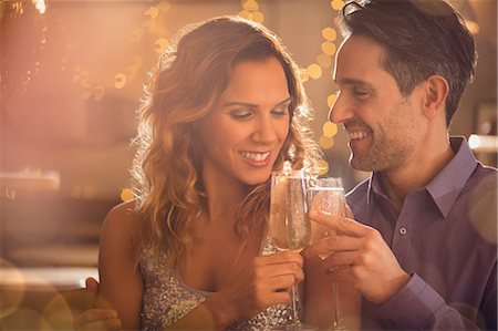 simsearch:700-06553388,k - Couple toasting champagne glasses Stock Photo - Premium Royalty-Free, Code: 6124-08945997