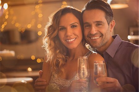 simsearch:6113-07543617,k - Portrait smiling couple drinking champagne Stock Photo - Premium Royalty-Free, Code: 6124-08946087