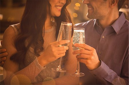 simsearch:6113-07543617,k - Affectionate couple toasting champagne flutes Stock Photo - Premium Royalty-Free, Code: 6124-08946100