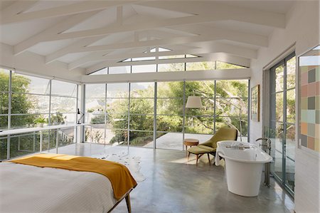 Modern luxury home showcase interior bedroom with garden view Stock Photo - Premium Royalty-Free, Code: 6124-08908036