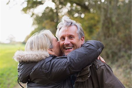 simsearch:6113-07543676,k - Portrait happy, playful mature couple hugging in park Stock Photo - Premium Royalty-Free, Code: 6124-09167267