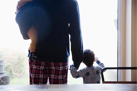 simsearch:649-07437107,k - Father and sons in pajamas at window Stock Photo - Premium Royalty-Free, Code: 6124-09167332