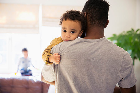 simsearch:6113-07543205,k - Portrait innocent baby boy over fathers shoulder Stock Photo - Premium Royalty-Free, Code: 6124-09178079