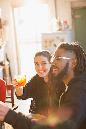 simsearch:6113-07543030,k - Happy young couple enjoying cocktails Stock Photo - Premium Royalty-Free, Code: 6124-09188504