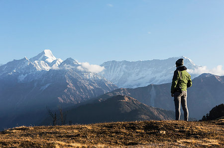 simsearch:693-06667816,k - Solo female traveler looking at majestic mountain view, Jaikuni, Indian Himalayan Foothills Stock Photo - Premium Royalty-Free, Code: 6124-09188618