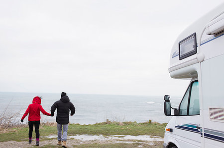 simsearch:6113-07589470,k - Couple holding hands outside motor home overlooking ocean Stock Photo - Premium Royalty-Free, Code: 6124-09188795