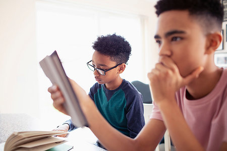 Teenage boys doing homework Stock Photo - Premium Royalty-Free, Code: 6124-09269972