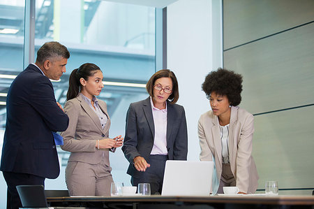 simsearch:614-03507042,k - Business people working at laptop in conference room meeting Stock Photo - Premium Royalty-Free, Code: 6124-09229163