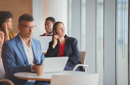 simsearch:649-07119200,k - Thoughtful businesswoman looking out window in cafeteria Stock Photo - Premium Royalty-Free, Code: 6124-09229169