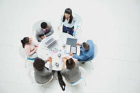 simsearch:6113-06899132,k - High angle view businesswoman leading meeting at round table Stock Photo - Premium Royalty-Free, Code: 6124-09229131