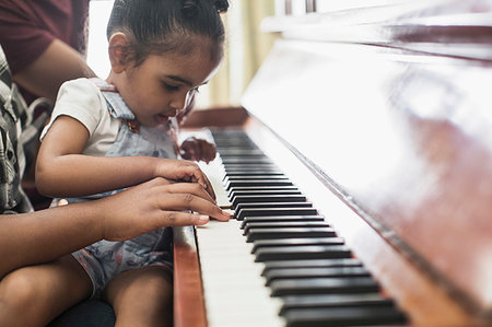 simsearch:649-06716505,k - Curious toddler girl playing piano Stock Photo - Premium Royalty-Free, Code: 6124-09239347