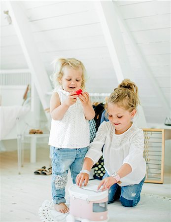 simsearch:6126-08644727,k - Sweden, Sisters (2-3, 6-7) playing with toy truck in bedroom Stock Photo - Premium Royalty-Free, Code: 6126-08643918