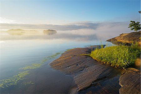 simsearch:6126-08643505,k - Sweden, Stockholm Archipelago, Uppland, Lidingo, View of lake and islands at dawn Stock Photo - Premium Royalty-Free, Code: 6126-08644676