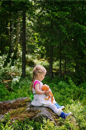 simsearch:6126-08644727,k - Finland, Paijat-Hame, Side-view of girl (2-3) sitting with doll on rock Stock Photo - Premium Royalty-Free, Code: 6126-08644722