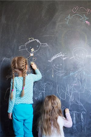 simsearch:6126-08644727,k - Finland, Sisters (12-17 months, 4-5) drawing on chalkboard Stock Photo - Premium Royalty-Free, Code: 6126-08644739