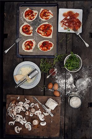 View of variation of pizza's ingredients Stock Photo - Premium Royalty-Free, Code: 6126-08635689