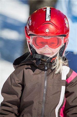 simsearch:6126-08644727,k - Norway, Osterdalen, Trysil, Portrait of smiling girl (4-5) standing on ski slope Stock Photo - Premium Royalty-Free, Code: 6126-08636008