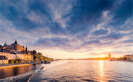 facade - Sweden, Stockholm, Sodermalm, Sodermalarstrand, Waterfront at sunset Stock Photo - Premium Royalty-Free, Code: 6126-08781489