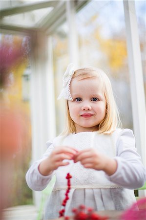 simsearch:6126-08644727,k - Finland, Girl (2-3) stringing beads in house Stock Photo - Premium Royalty-Free, Code: 6126-08781556