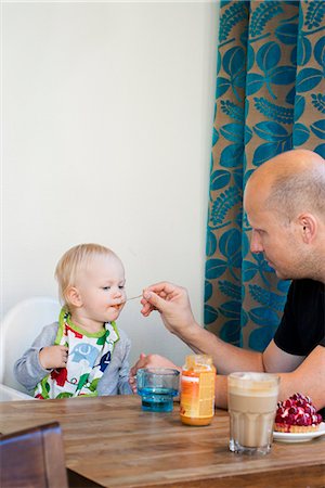 simsearch:859-06808650,k - Father feeding baby son Stock Photo - Premium Royalty-Free, Code: 6126-09102603