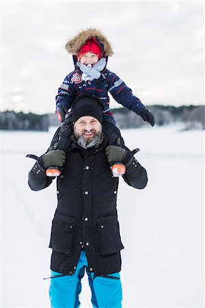 simsearch:6108-06167383,k - Son of fathers shoulders in snow Stock Photo - Premium Royalty-Free, Code: 6126-09103933