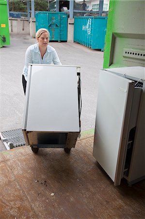 finnish ethnicity - Woman loading refrigerator into truck Stock Photo - Premium Royalty-Free, Code: 6126-09104143