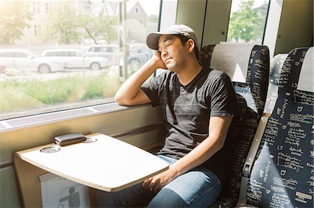 Man sleeping on train Stock Photo - Premium Royalty-Free, Code: 6126-09104335