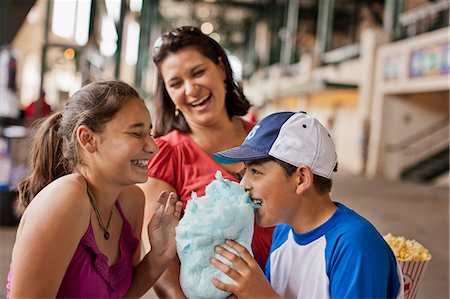 simsearch:693-06013834,k - Happy family enjoying a day out at a sporting event. Stock Photo - Premium Royalty-Free, Code: 6128-08747450