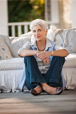 photo of person sitting on porch - Portrait of a mature woman sitting on her porch. Stock Photo - Premium Royalty-Free, Code: 6128-08747751