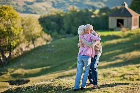 simsearch:6128-08738334,k - Senior couple sharing a hug. Stock Photo - Premium Royalty-Free, Code: 6128-08747784