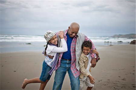 Family having fun at beach. Stock Photo - Premium Royalty-Free, Code: 6128-08747805