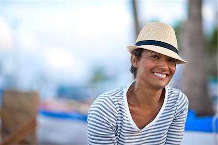 fancy (highly decorated) - Portrait of mature woman smiling wearing fedora. Stock Photo - Premium Royalty-Free, Code: 6128-08748043