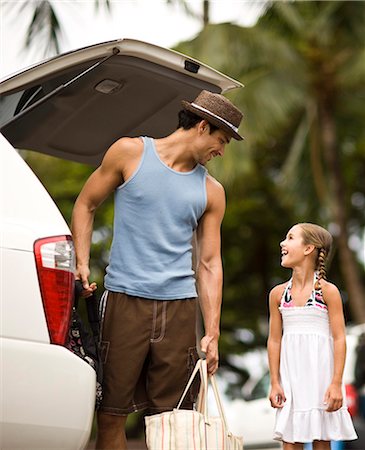 family loading car - Father unloading bags from car boot with little girl. Stock Photo - Premium Royalty-Free, Code: 6128-08766556