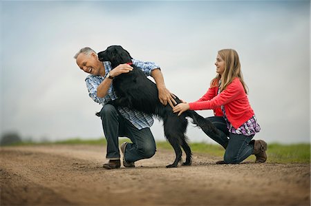 simsearch:6128-08738334,k - Dog playfully jumping up on its owner. Stock Photo - Premium Royalty-Free, Code: 6128-08767294