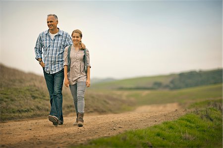 simsearch:6128-08738334,k - Smiling middle aged man walking with his teenage daughter. Stock Photo - Premium Royalty-Free, Code: 6128-08767299