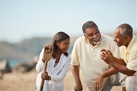 photos of african american grandparents - Happy multi generational family talking on a beach. Stock Photo - Premium Royalty-Free, Code: 6128-08767213