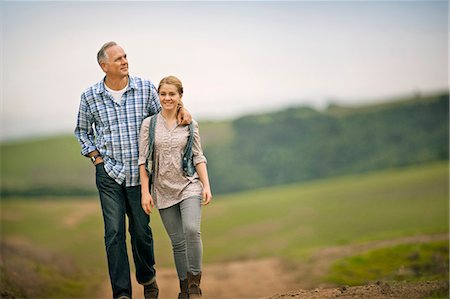 simsearch:6128-08738334,k - Smiling middle aged man walking with his teenage daughter. Stock Photo - Premium Royalty-Free, Code: 6128-08767303