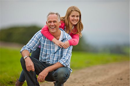 parent and teenager coloured people - Portrait of a smiling father and daughter. Stock Photo - Premium Royalty-Free, Code: 6128-08767301