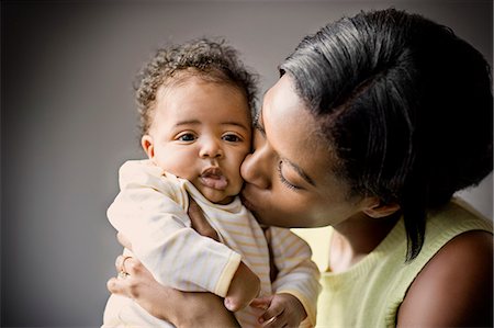 Young mother holding her baby. Stock Photo - Premium Royalty-Free, Code: 6128-08780379