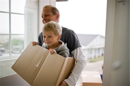 simsearch:700-06758135,k - Father carrying son in box while moving house Stock Photo - Premium Royalty-Free, Code: 6128-08780427