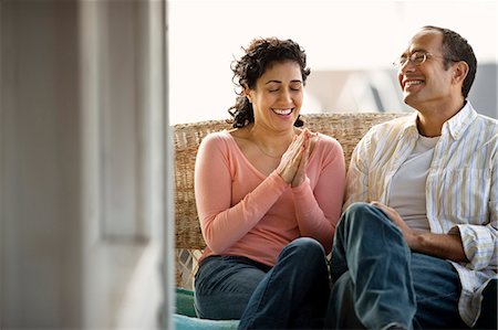 simsearch:6128-08738334,k - Happy mid adult couple sitting on a front porch. Stock Photo - Premium Royalty-Free, Code: 6128-08780509