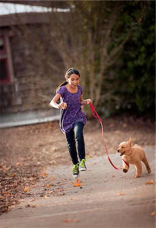 simsearch:700-00166478,k - Girl running with puppy. Stock Photo - Premium Royalty-Free, Code: 6128-08780624
