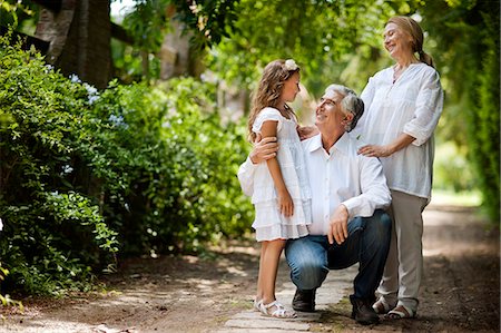 Portrait of young girl with her grandparents. Stock Photo - Premium Royalty-Free, Code: 6128-08780705